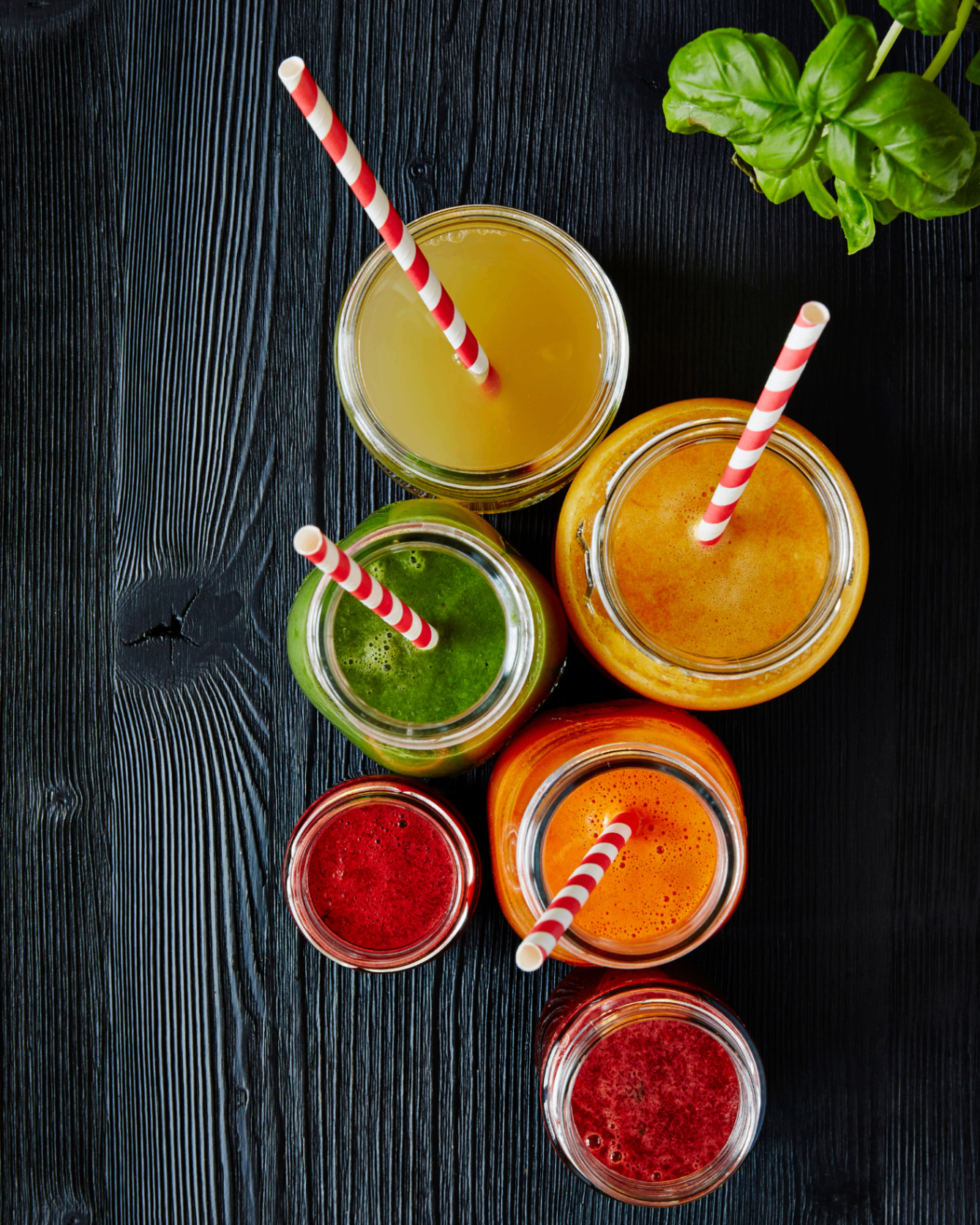 Cold-pressed Trap Juice jars — green, citrus, mango, carrot, and beet blends